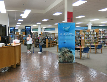 Exhibit banner in the entrance to a library