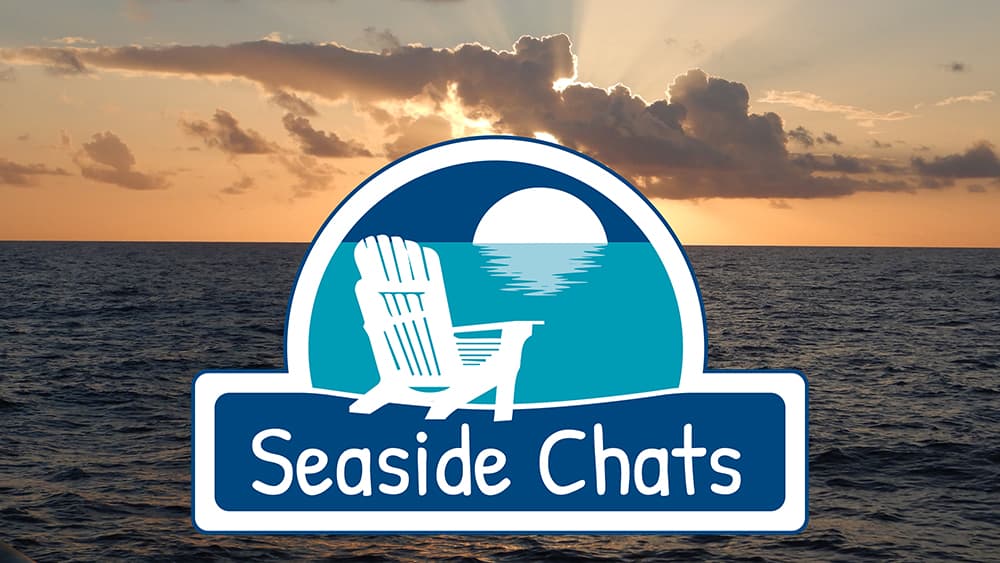 Seaside Chats emblem overlaid on a sunset over the ocean