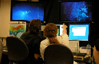 Scientists at a remote observation console.