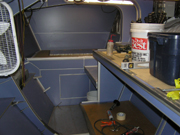 Lower cabin with blue walls and surfaces installed