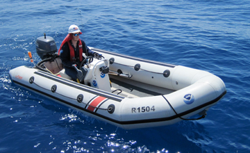 Ryan driving a rigid hull inflatable boat