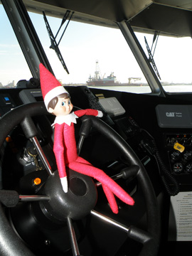 Elf doll sitting on the steering wheel of R/V MANTA.