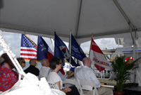 The American, Texas, NOAA, Sanctuaries and Troop 207 flags fluttering in the breeze alongside the speakers' dais.
