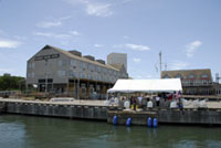 A view of Pier 21, Harbor House Hotel, the ceremony tents and Willie G's restaurant from the water (photographer was on board the Manta).