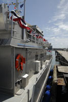 A view of the starboard side of the Manta looking from the back deck toward the bow.  The pier is slightly visible to the right.
