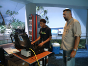 A NOAA Fisheries scientist tells a student how to operate the ROV.