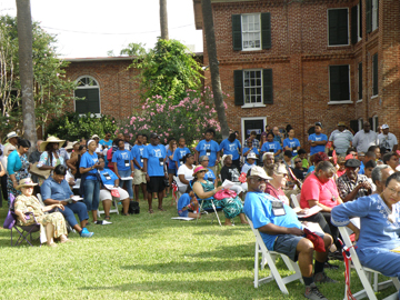 Crowd of people at the Ashton Villa Juneteenth celebration on the lawn.