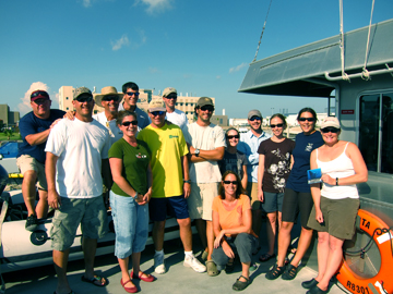 Group of 14 researchers and crew members on the top deck of R/V MANTA