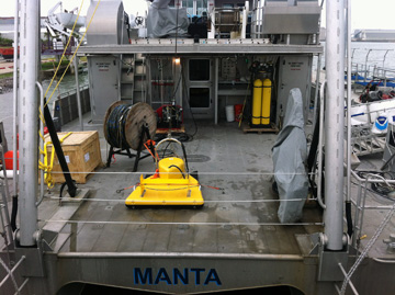 Bright yellow piece of equipment sitting on deck of R/V MANTA