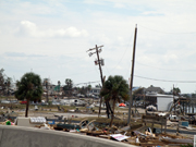 Broken buildings and scattered debris in Galveston alongside the highway after Hurricane Ike