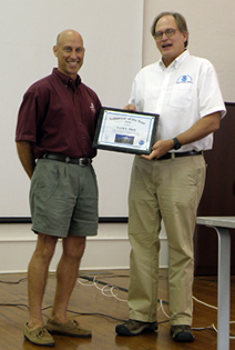 Kevin receiving his 2011 Volunteer of the Year plaque from sanctuary manager GP Schmahl