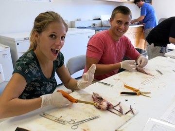 Two Texas A&M Galveston students assist with lionfish dissections