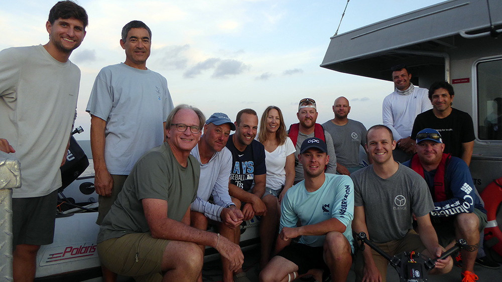 Group of divers and crew on the top deck of R/V MANTA